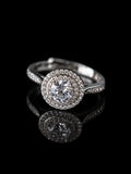 Silver Round Double Halo Ring on a black background