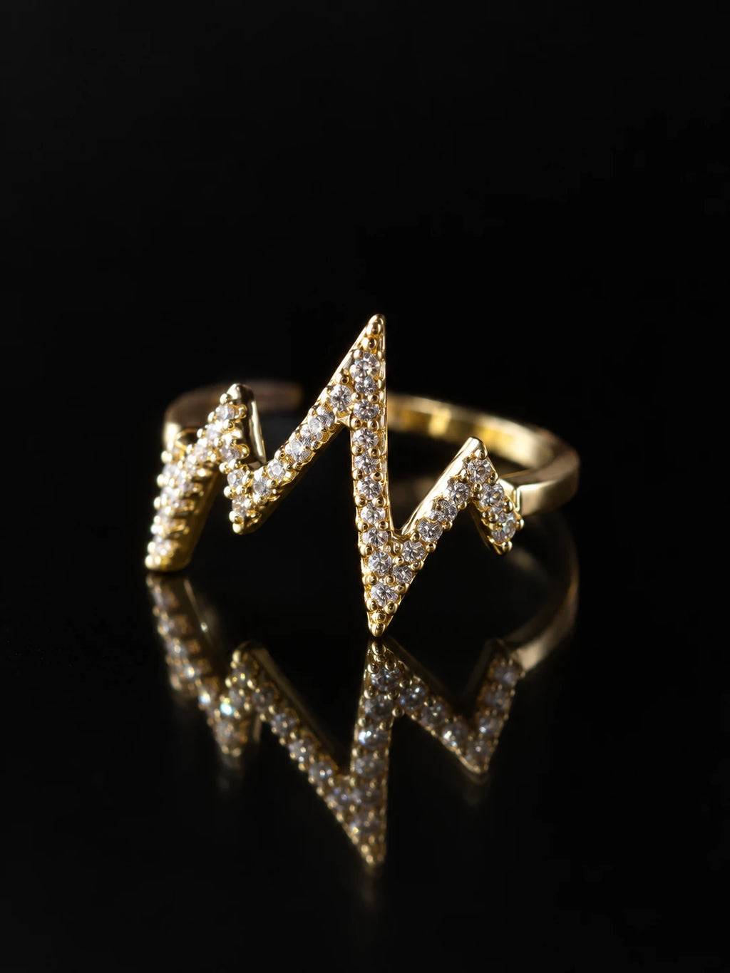 Gold Heartbeat Open Ring on a black background