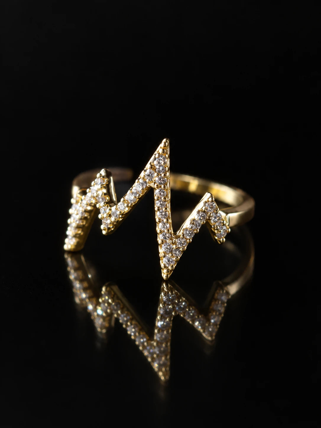 Gold Heartbeat Open Ring on a black background
