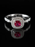 Silver Ruby-Red CZ Cushion Halo Ring on a black background