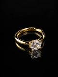 Gold Round CZ Solitaire Ring on a black background