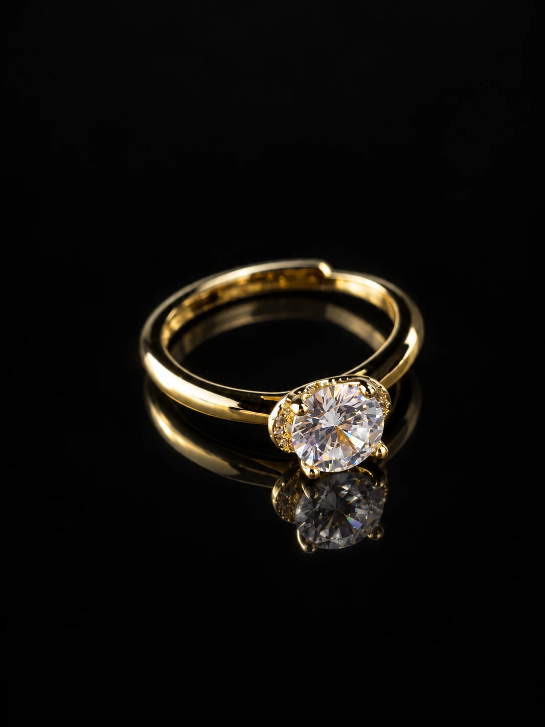 Gold Round CZ Solitaire Ring on a black background
