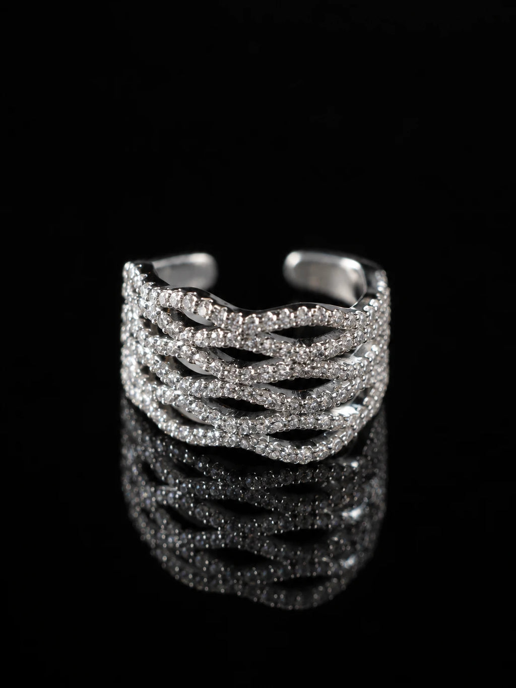 Silver Layered Wave Ring on a black background