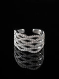 Silver Layered Wave Ring on a black background