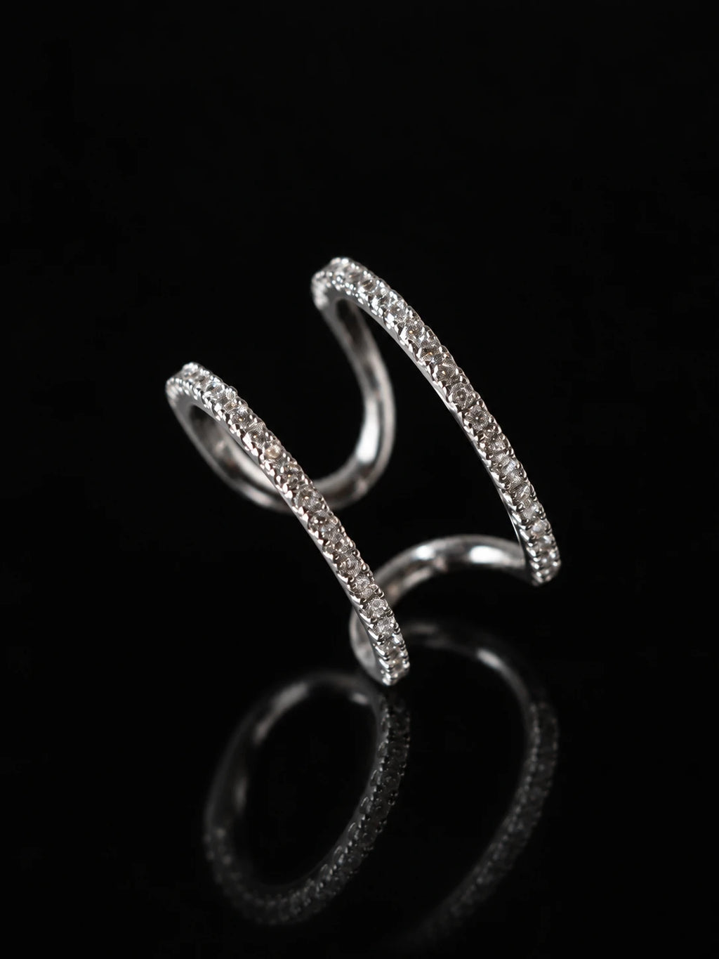 Silver Double Arc Open Ring on a black background