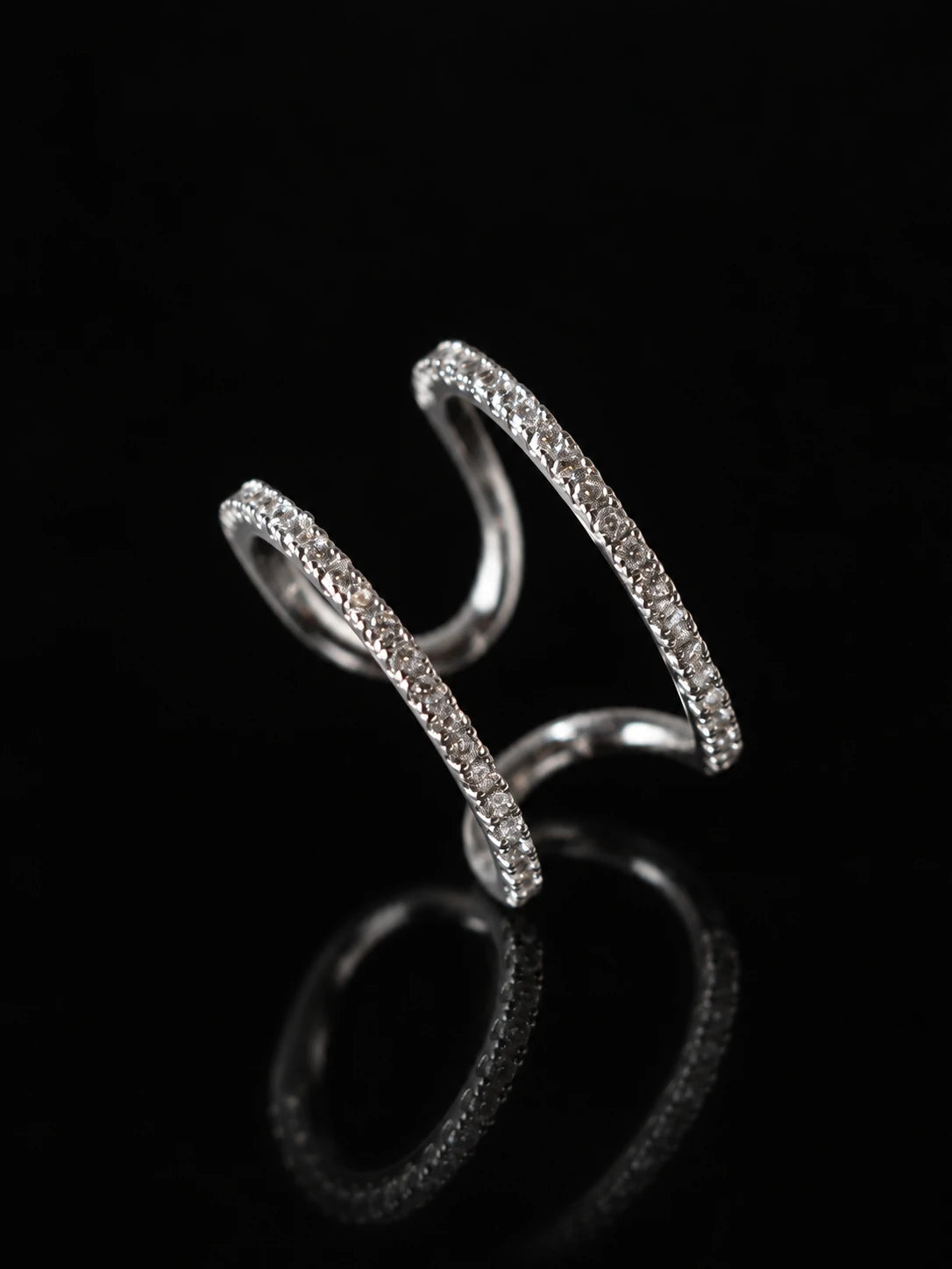 Silver Double Arc Open Ring on a black background