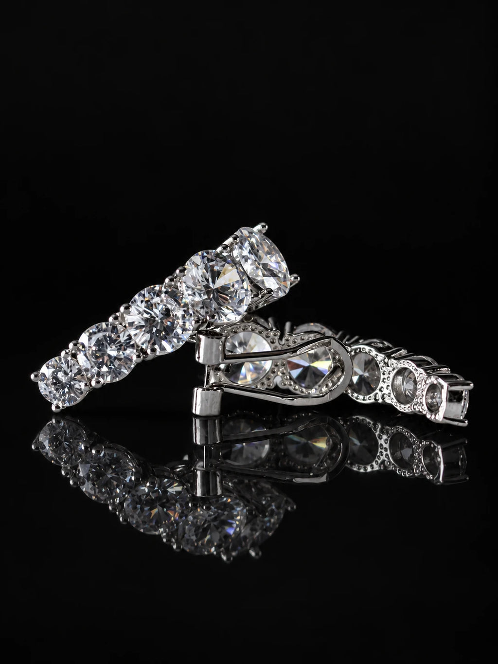 Curved Pavé Hoop Earrings on a black background