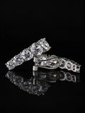 Curved Pavé Hoop Earrings on a black background