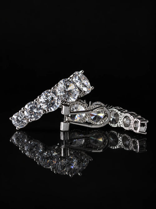 Curved Pavé Hoop Earrings on a black background