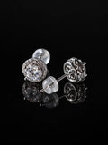 Silver CZ Starburst Stud Earrings on a black background
