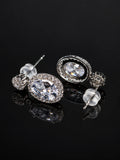 Vintage Silver Oval CZ Drop Earrings on a black background