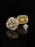 Golden Floral Star Stud Earrings on a black background