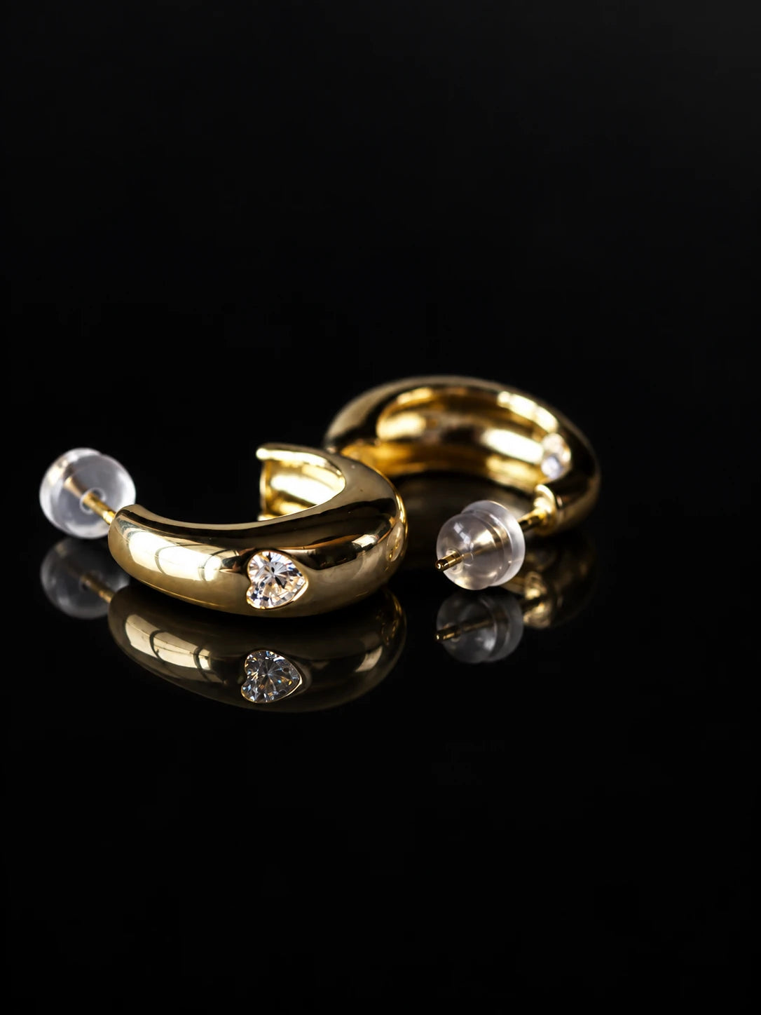 Gold Tone Half Hoop CZ Stud Earrings on a black background