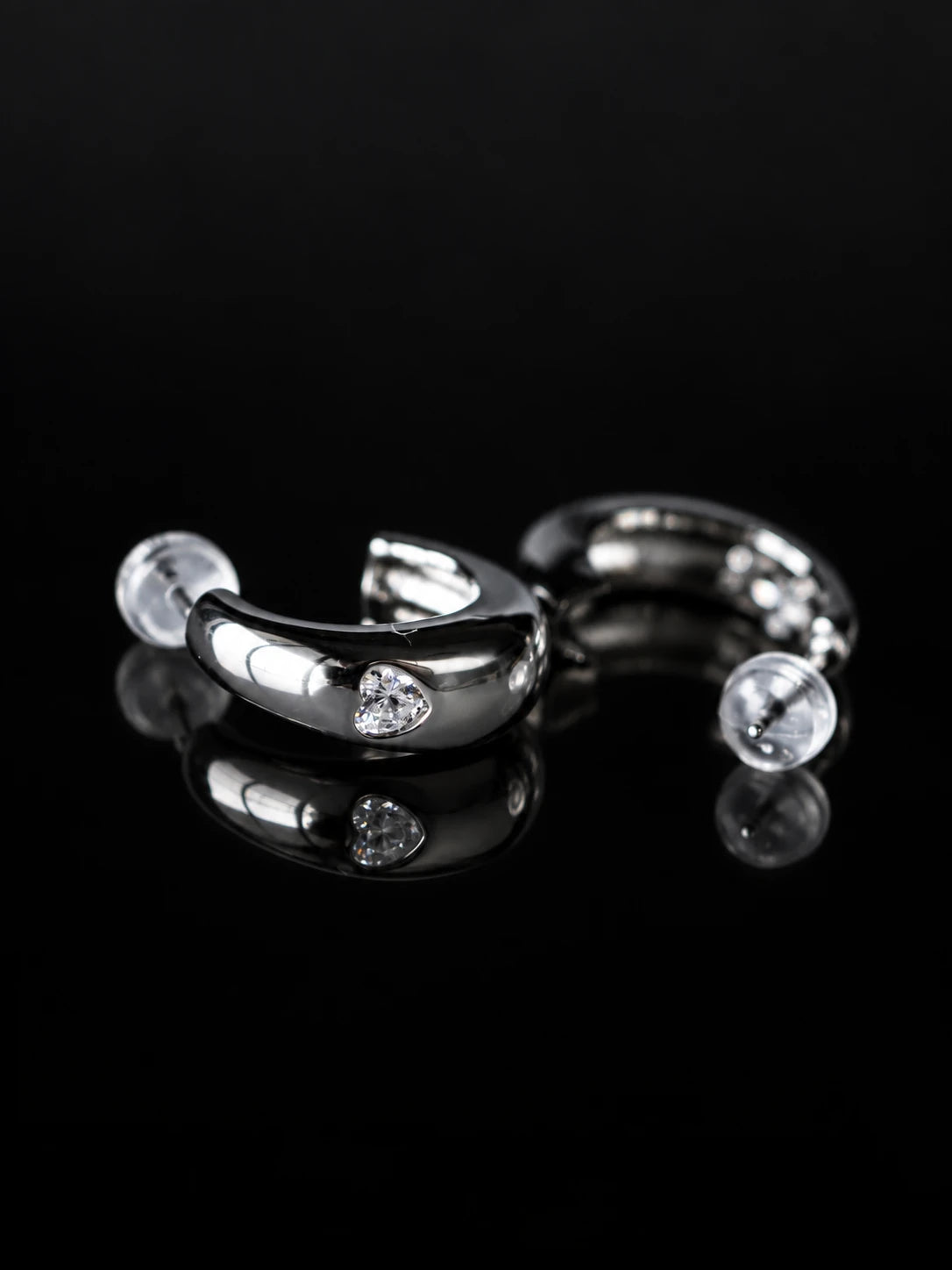 Silver Curve CZ Studs on a black background