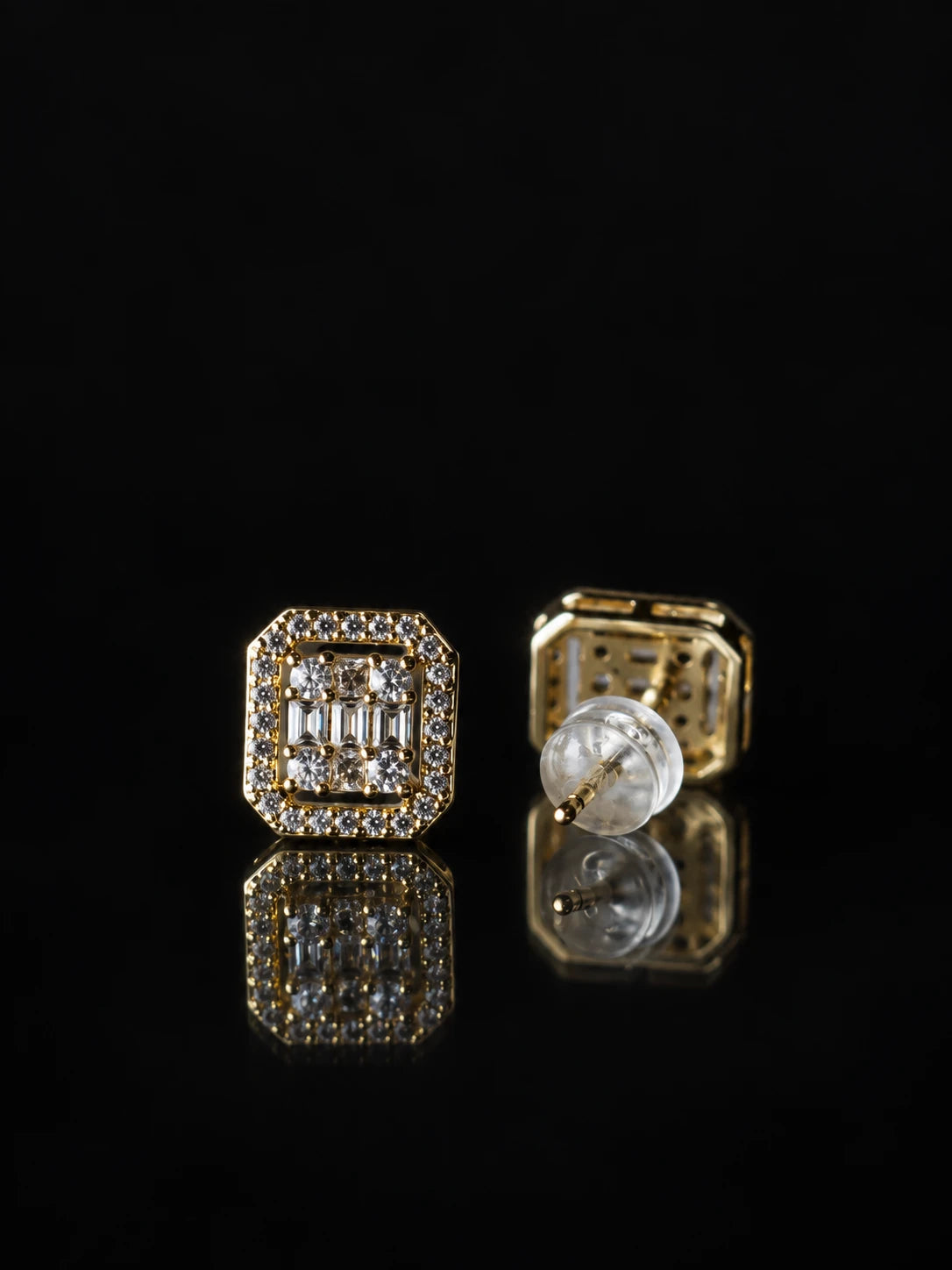 Gold Emerald-Cut Halo Studs on a black background