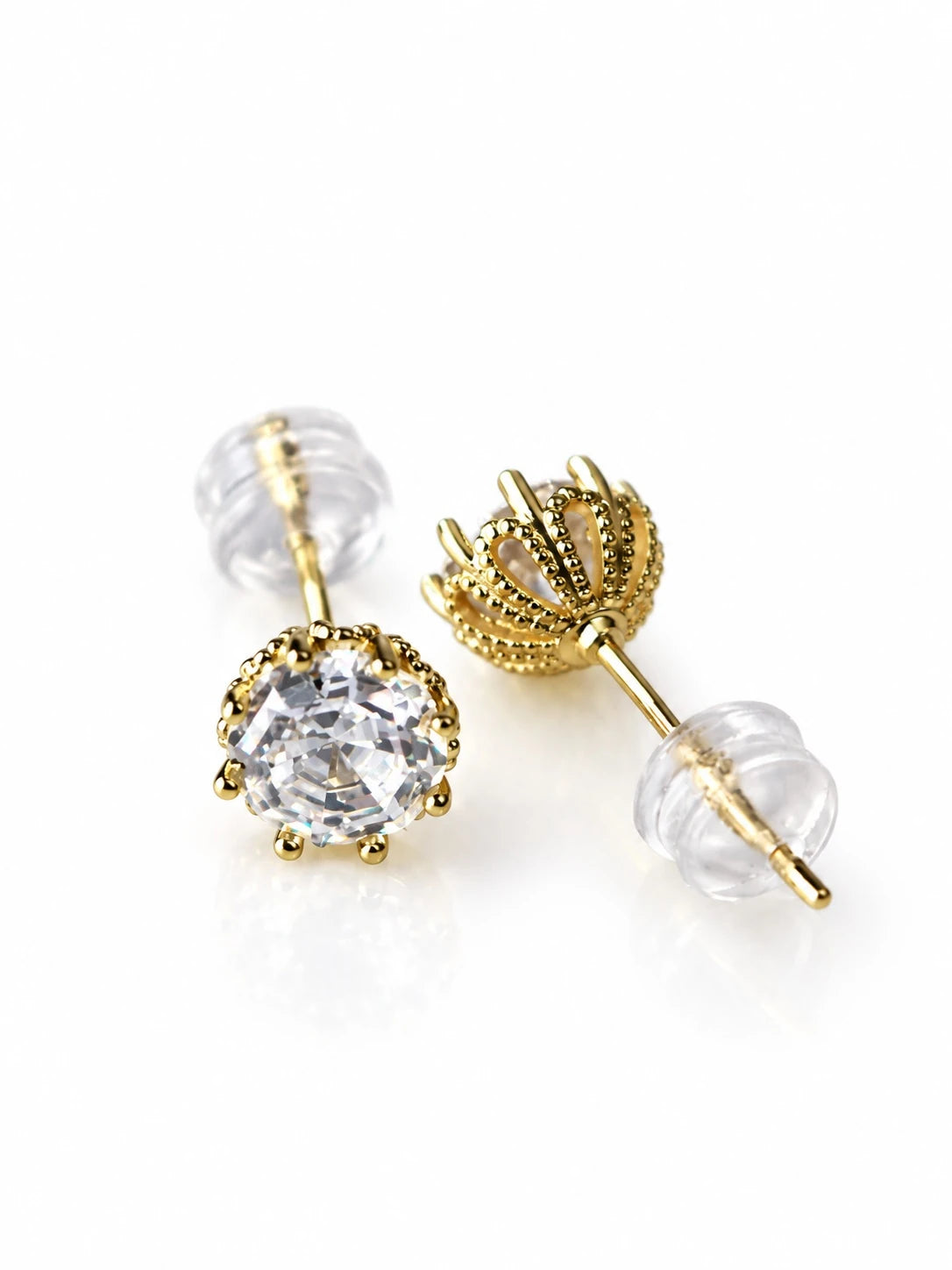 Gold Crown Solitaire Studs on a white background