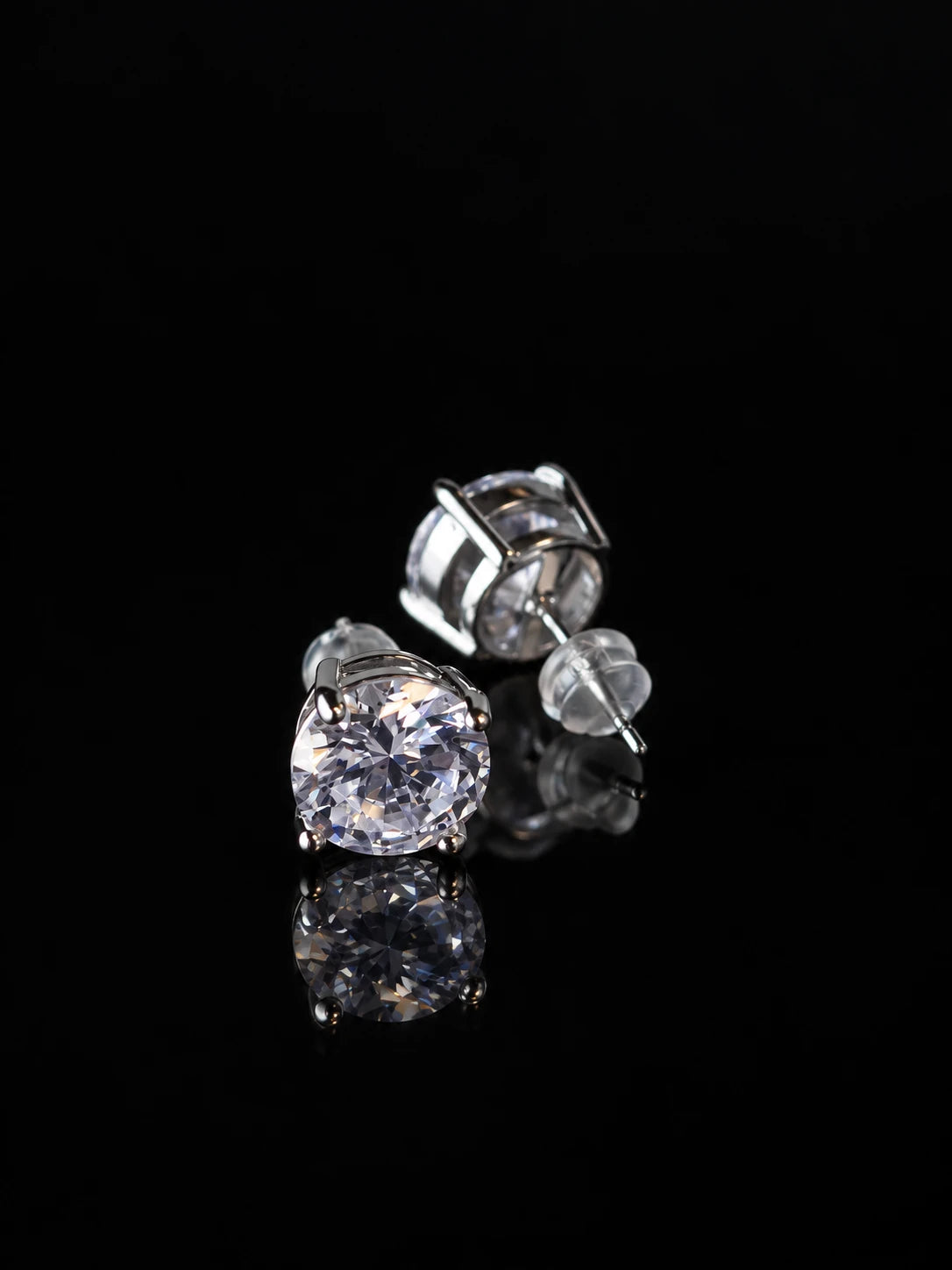 Silver Basket Solitaire Studs on a black background