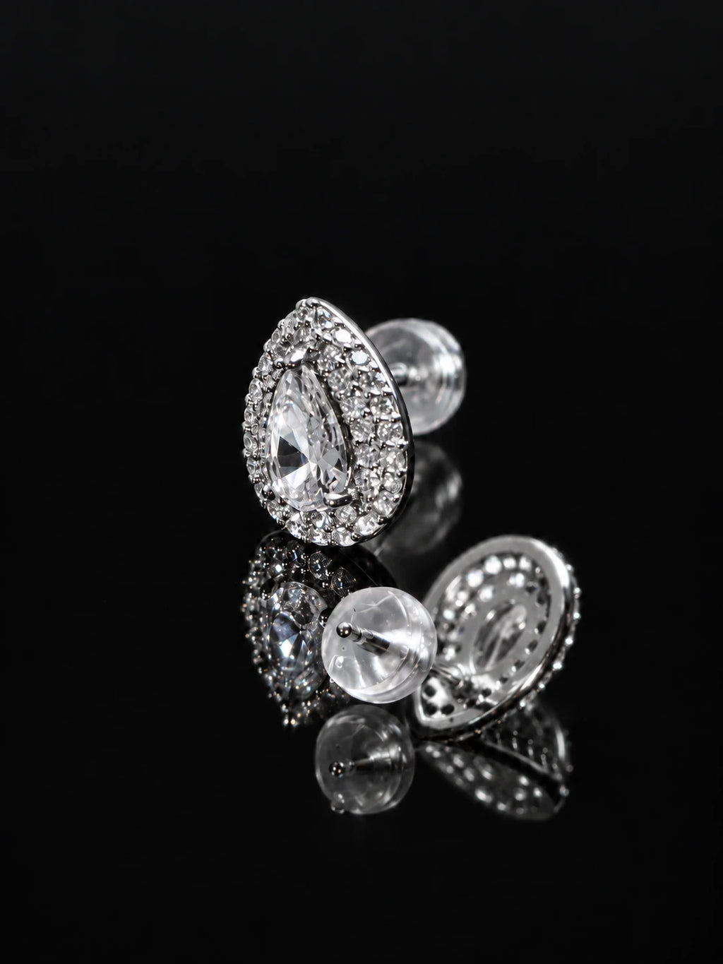 Silver Pear Halo Studs on a black background