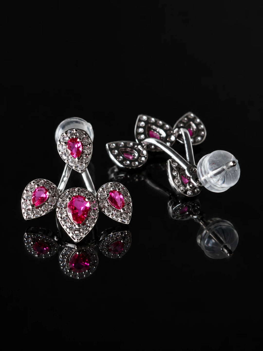 Ruby-Red CZ Cherry Jacket Studs on a black background