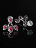 Ruby-Red CZ Cherry Jacket Studs on a black background