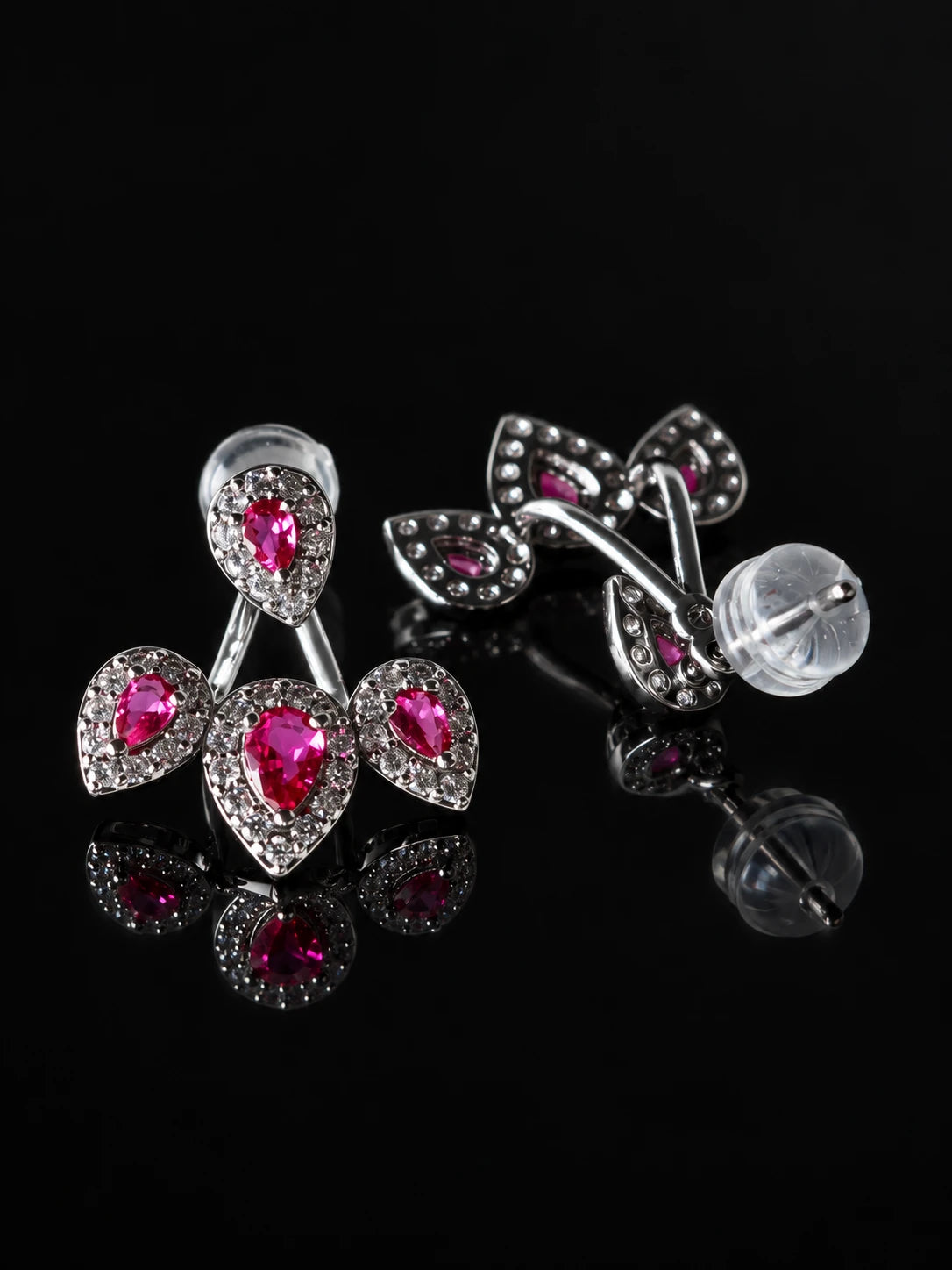 Ruby-Red CZ Cherry Jacket Studs on a black background