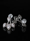 Clear CZ Cherry Jacket Studs on a black background