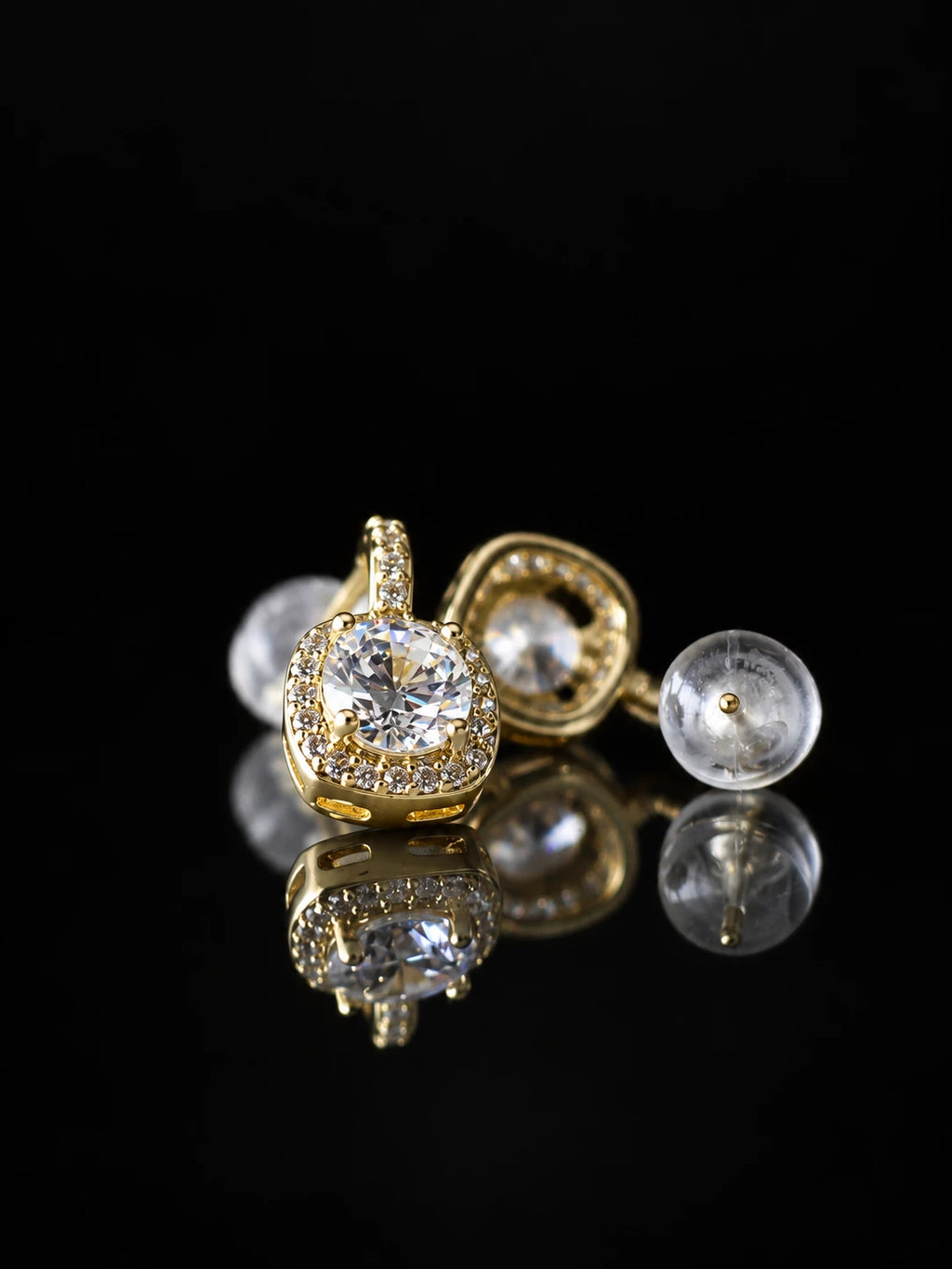 Gold Round Bezel Studs on a black background