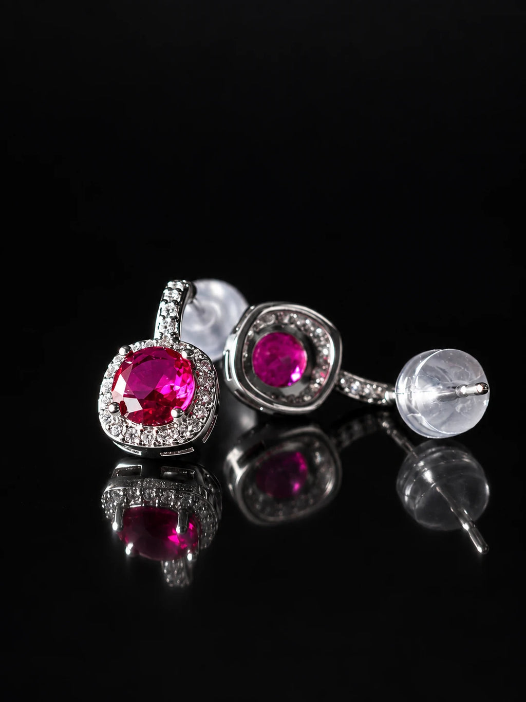 Silver Ruby-Red CZ Bezel Studs on a black background