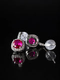 Silver Ruby-Red CZ Bezel Studs on a black background