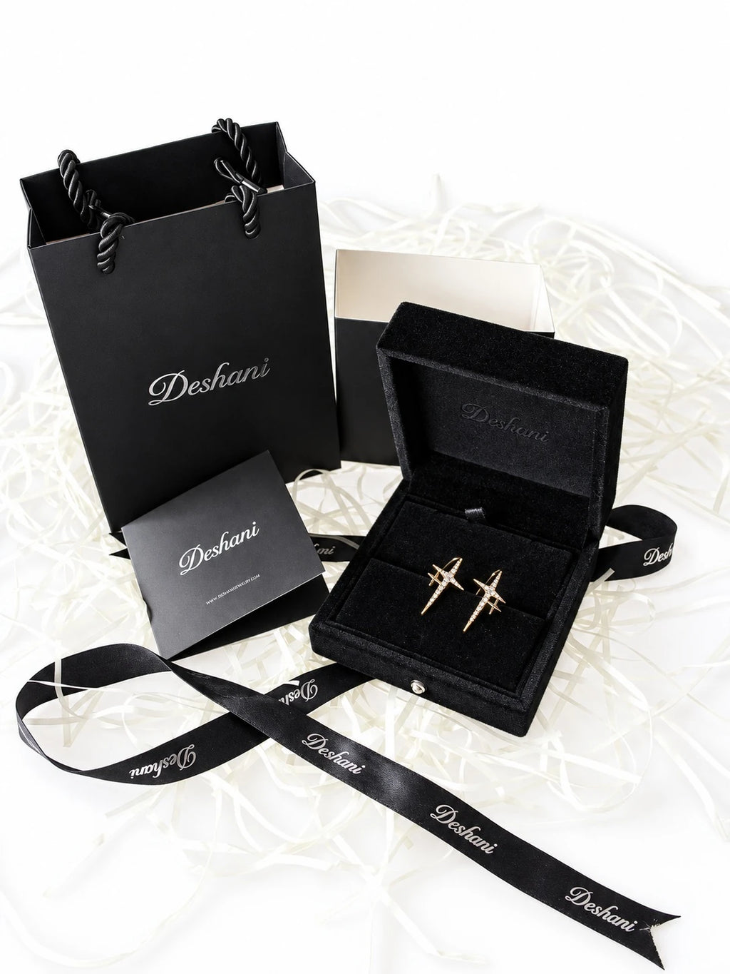 Gold Crossed Star Studs in Deshani gift-ready packaging