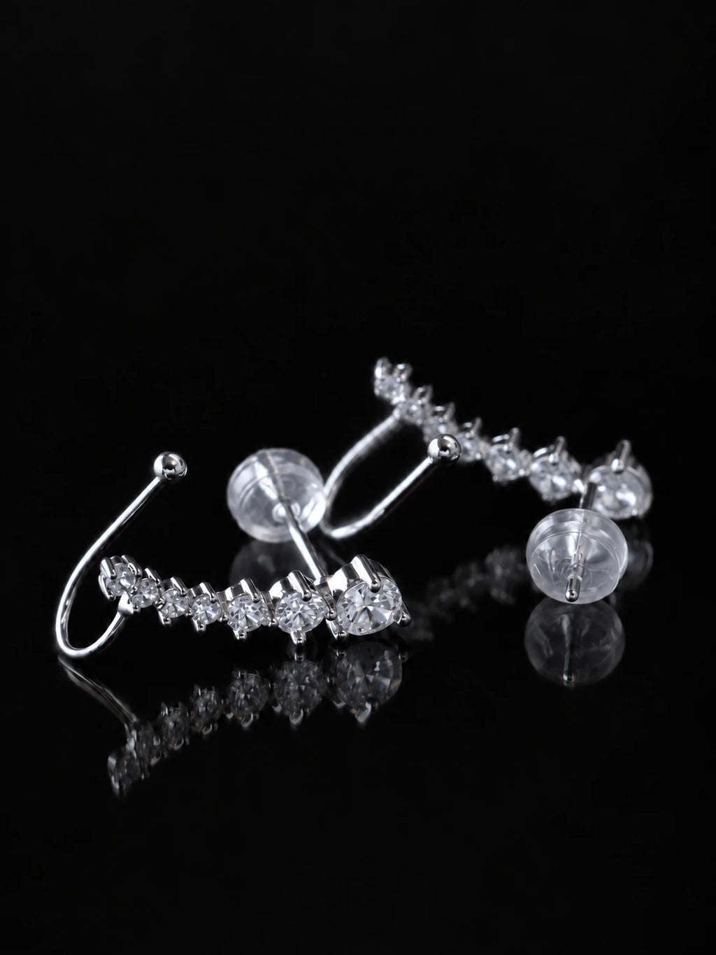 Silver Starline Ear Climbers on a black background