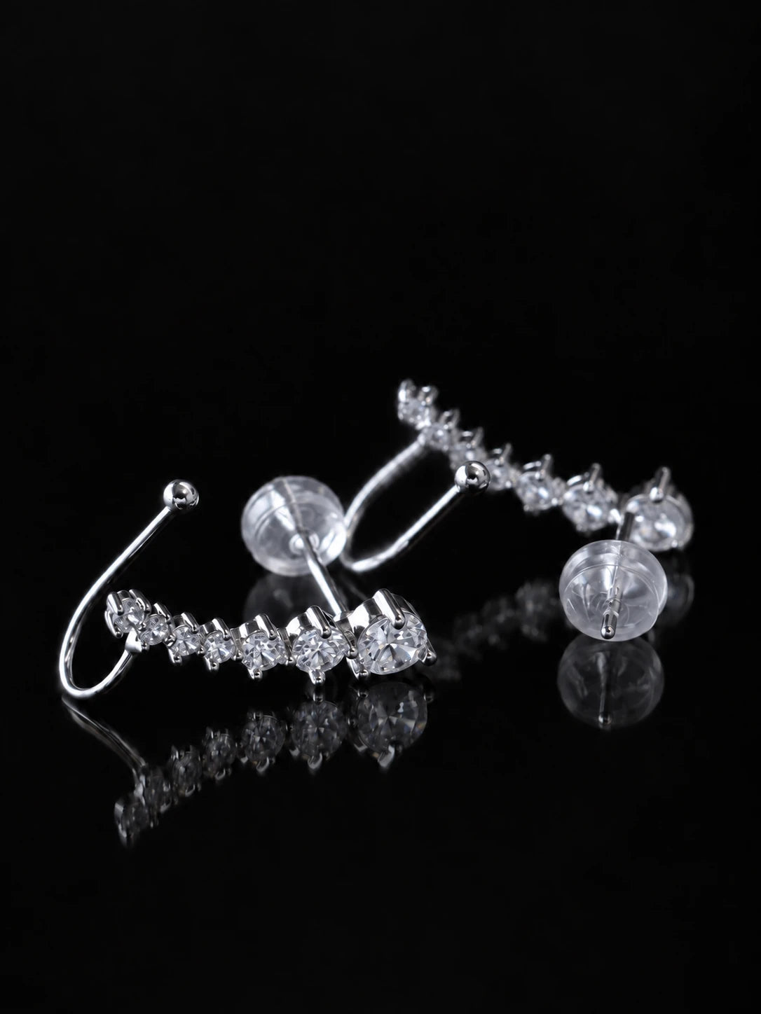 Silver Starline Ear Climbers on a black background