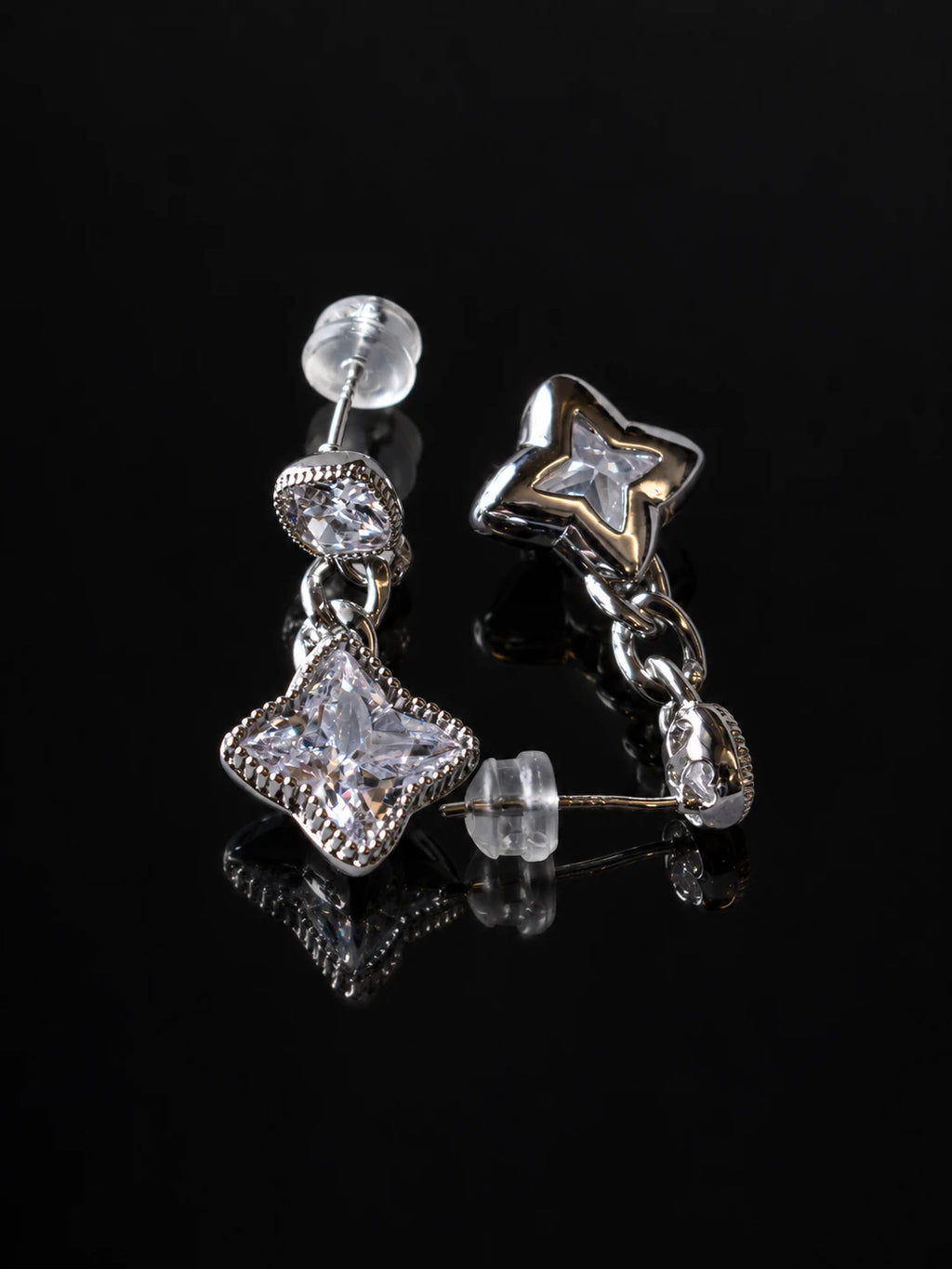 Silver Star Cushion Drops on a black background