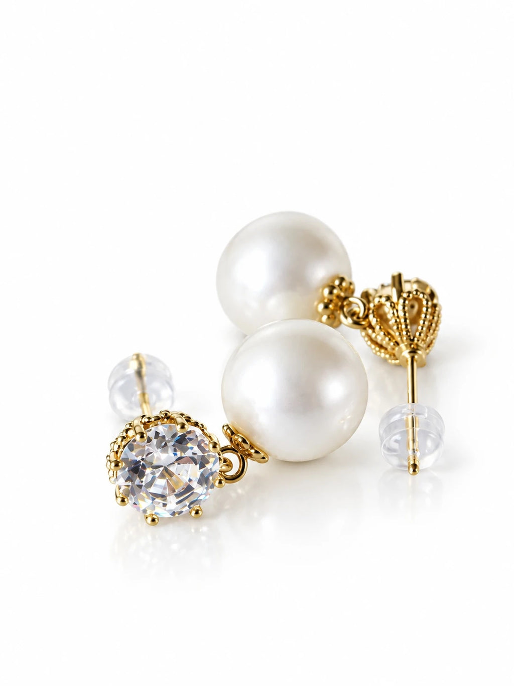 Gold Pearl Solitaire Studs on a white background