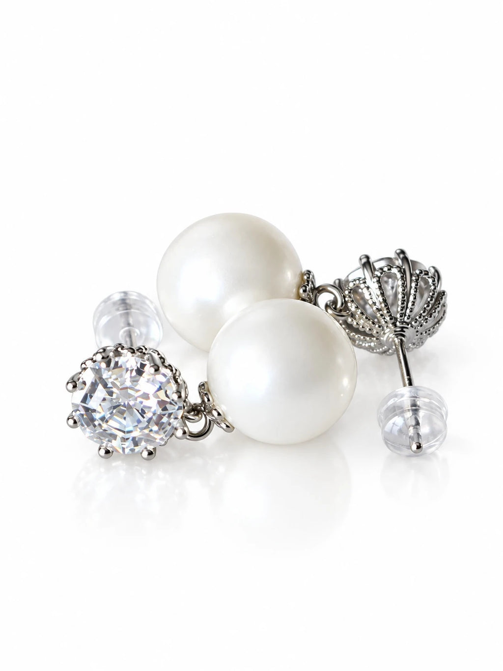 Silver Pearl Solitaire Studs on a white background