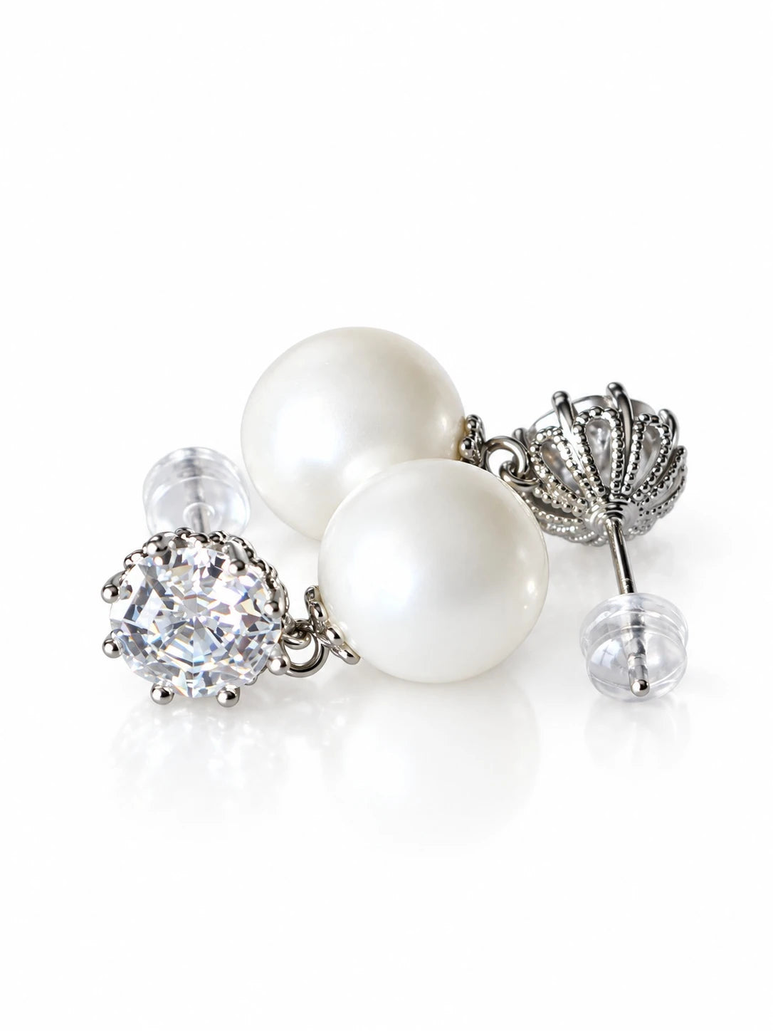 Silver Pearl Solitaire Studs on a white background