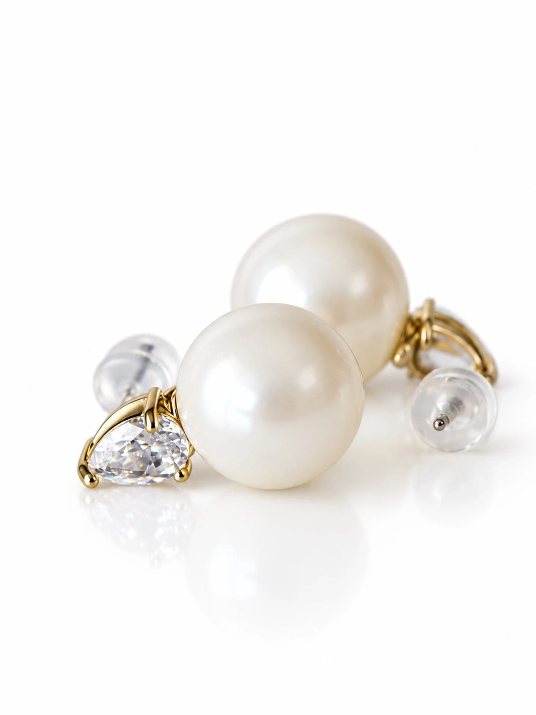 Gold Pearl Pear Accent Studs on a white background