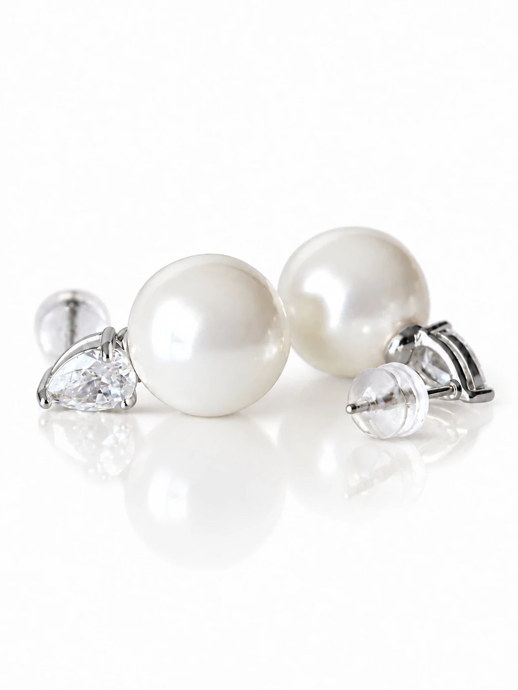 Gold Pearl Teardrop Studs on a white background