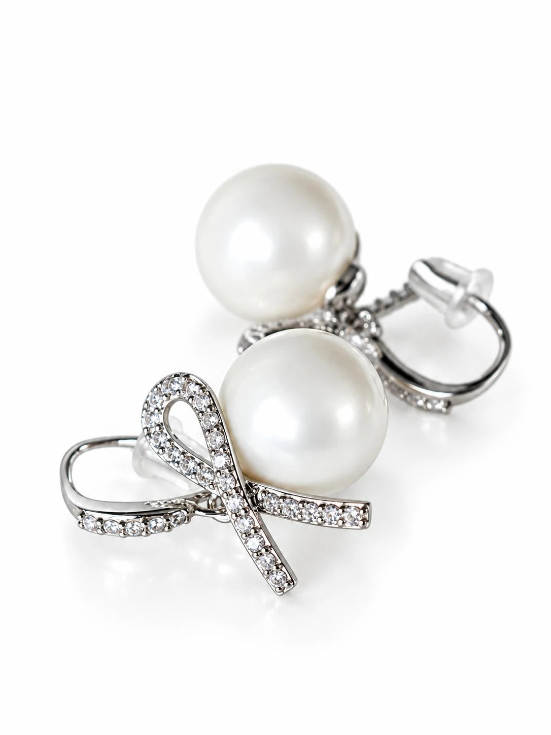 Silver Pearl Bow Studs on a white background