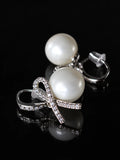Silver Pearl Bow Studs on a black background