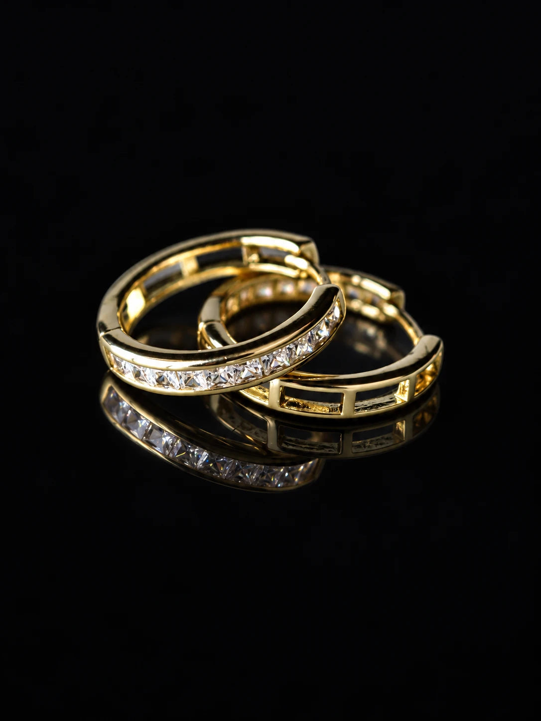 Gold Baguette Channel Hoops on a black background