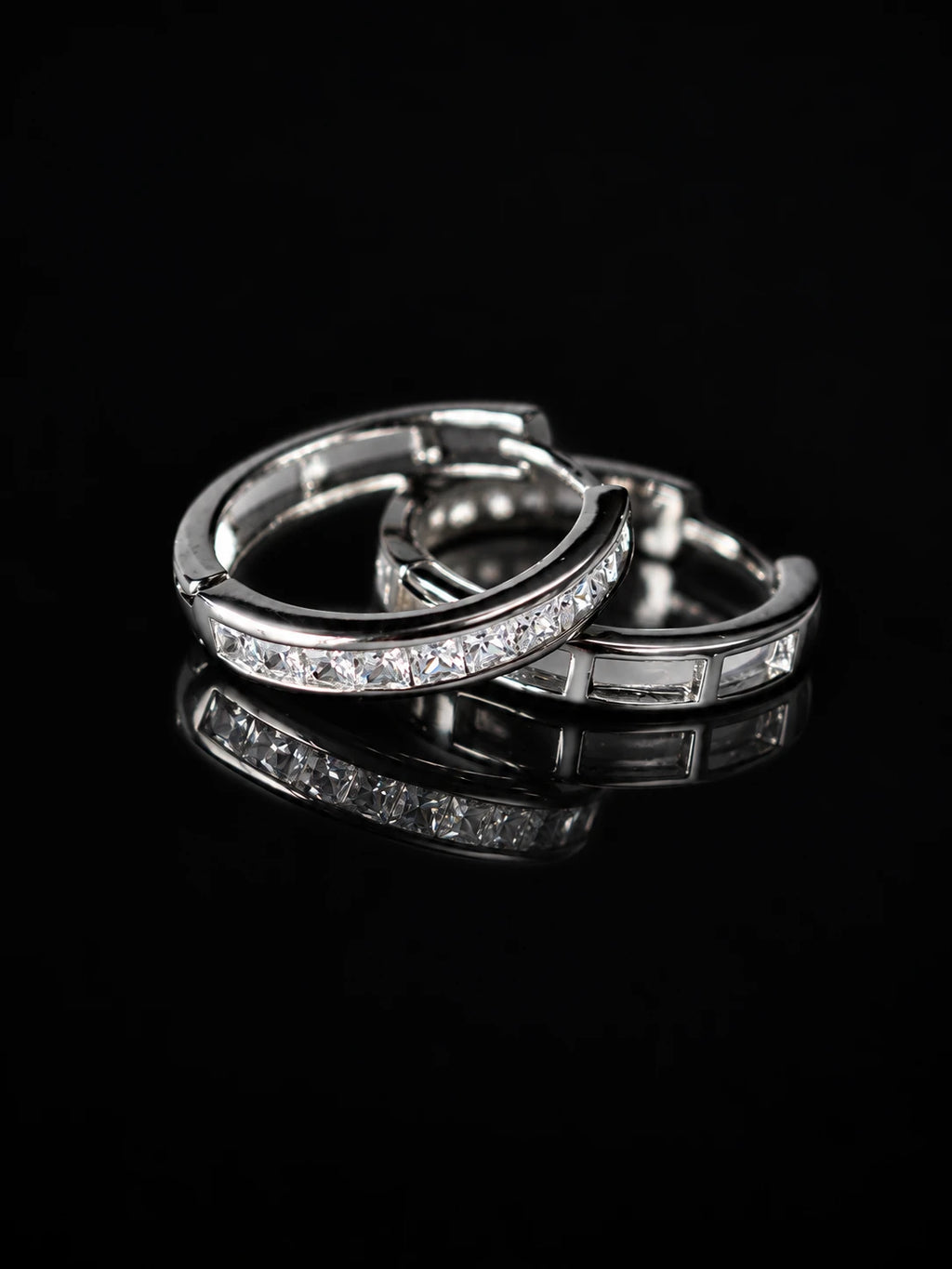 Silver Baguette Channel Hoops on a black background