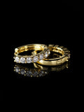 Gold Round Prong Hoops on a black background