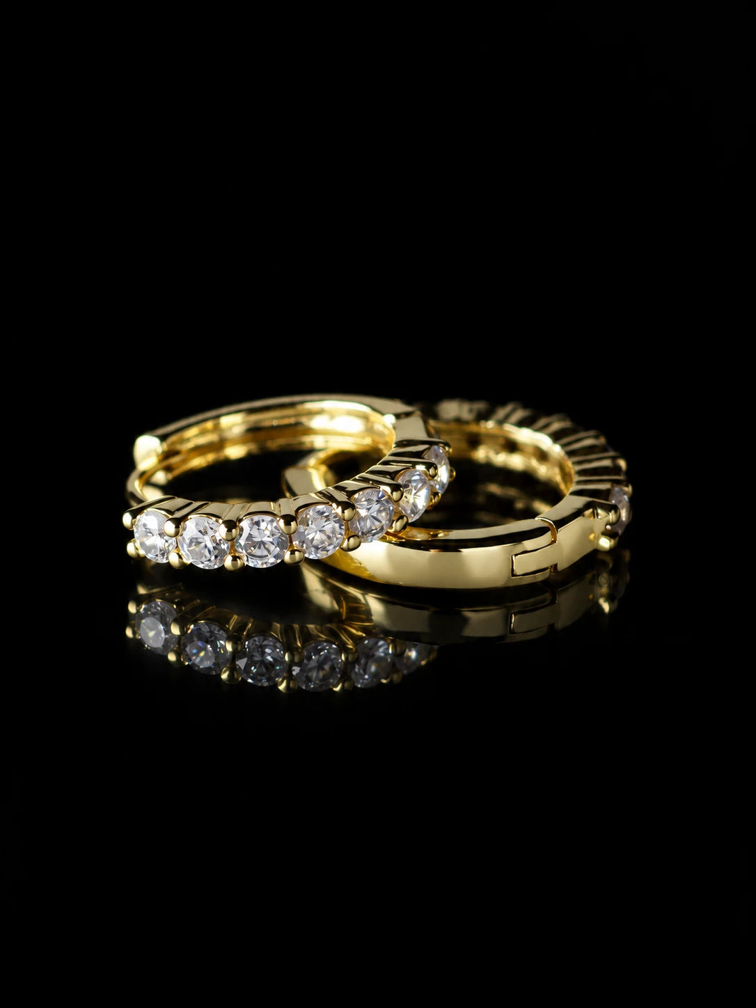 Gold Round Prong Hoops on a black background