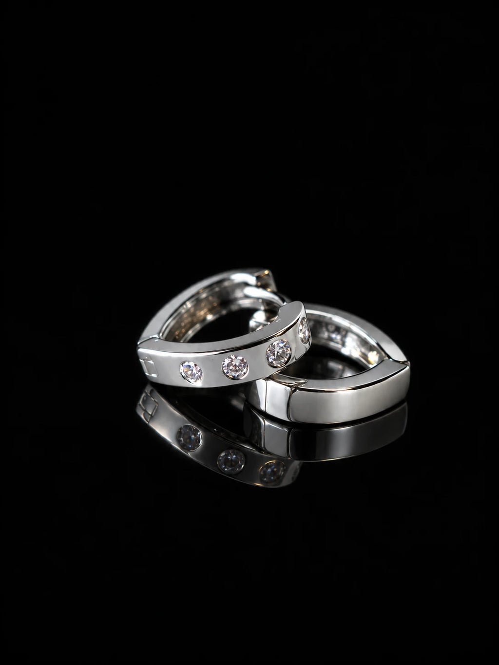 Silver Dot CZ Huggies on a black background