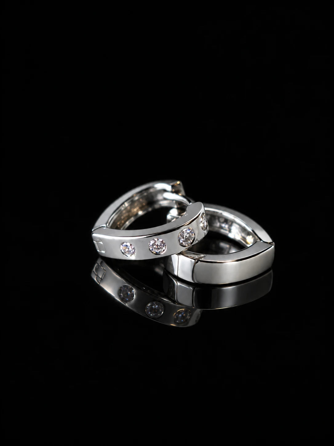 Silver Dot CZ Huggies on a black background