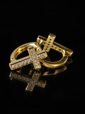 Gold Cross CZ Huggies on a black background