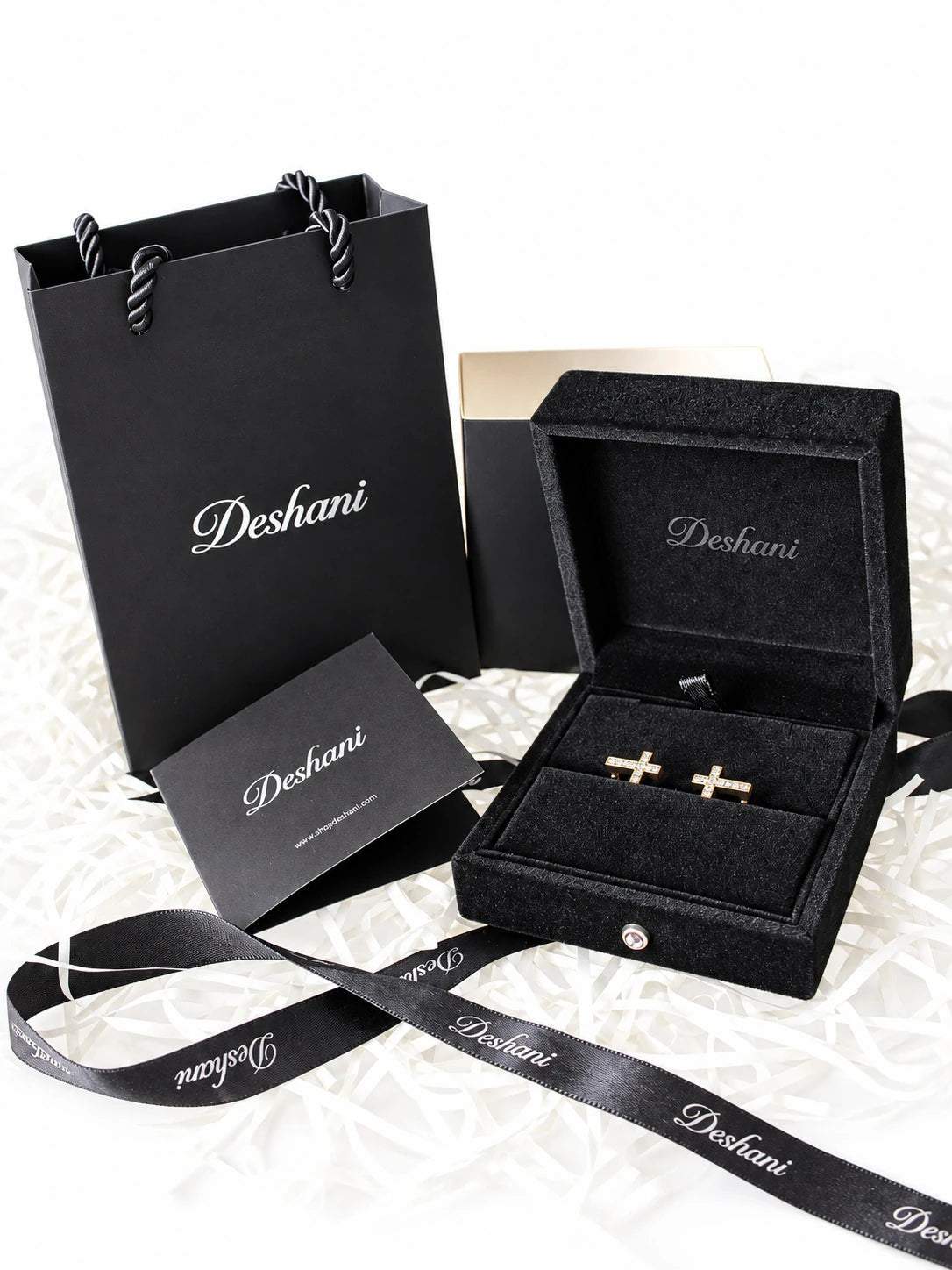 Gold Cross CZ Huggies in Deshani gift-ready packaging