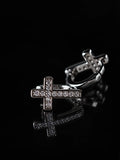 Black & Silver Cross CZ Huggies on a black background