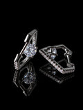 Silver Marquise Halo Huggies on a black background